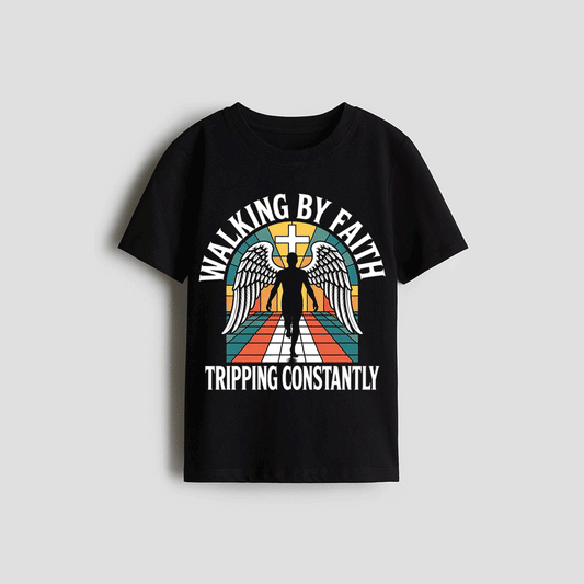 A black t-shirt with a graphic design featuring a winged figure and the text "WALKING BY FAITH TRIPPING CONSTANTLY" printed on it.