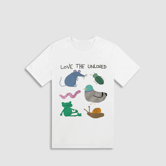 A white t-shirt with a graphic design featuring various cartoon-style animals, including a mouse, a frog, a bird, a snail, and a caterpillar, along with the text "LOVE THE UNLOVED".