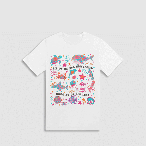 A white t-shirt with a colorful graphic design depicting various marine life, including fish, sharks, and sea creatures, along with the text "all of us are different. none of us are less".