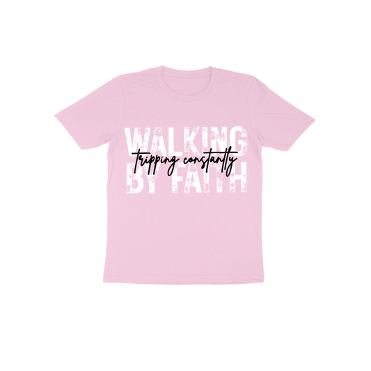 A pink t-shirt with the text "WALKING BY FAITH" printed on it in white letters.