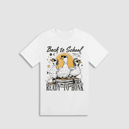 A white t-shirt with a graphic design featuring three cartoon ducks and the text "Back to School READY-TO-HONK" printed on it.