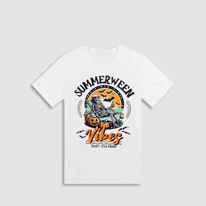 A white t-shirt with a graphic design featuring a skeleton sitting on a pumpkin and a bat flying above it, along with the text "SUMMERWEEN VIVES" and "SPOOKY YEAR ROUND".