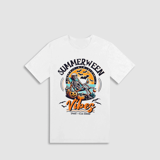 A white t-shirt with a graphic design featuring a skeleton sitting on a pumpkin and a bat flying above it, along with the text "SUMMERWEEN VIVES" and "SPOOKY YEAR ROUND".