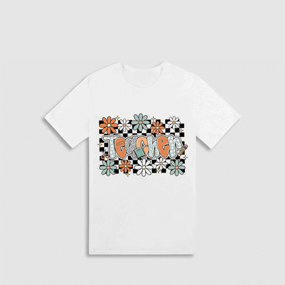 A white t-shirt with a graphic design featuring a floral pattern and the word "Toxo" written in a stylized font.