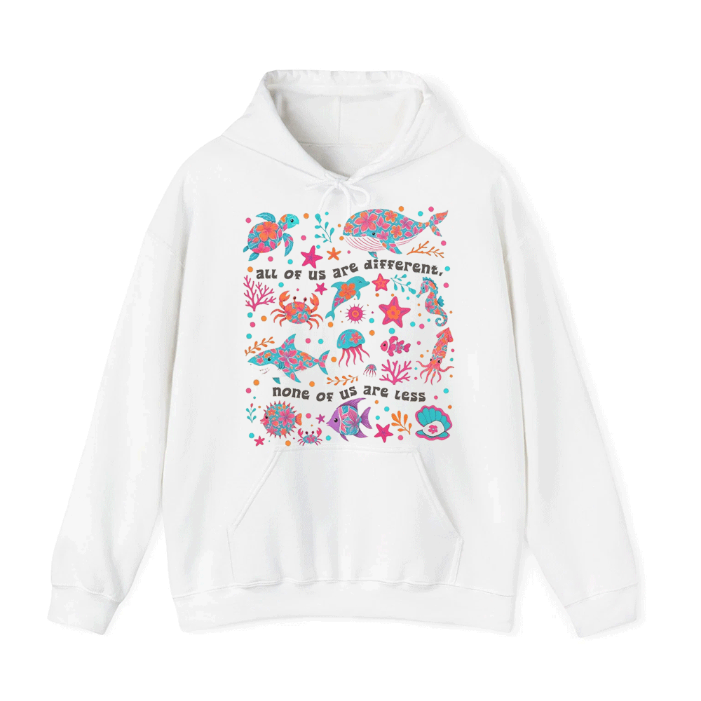 A white hoodie with a colorful graphic design featuring various marine life, such as fish, sea creatures, and coral, along with the text "All of us are different. None of us are less."