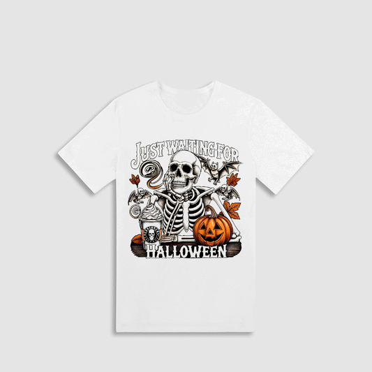 A white t-shirt with a Halloween-themed graphic design featuring a skeleton, a jack-o-lantern, and various Halloween-related elements.
