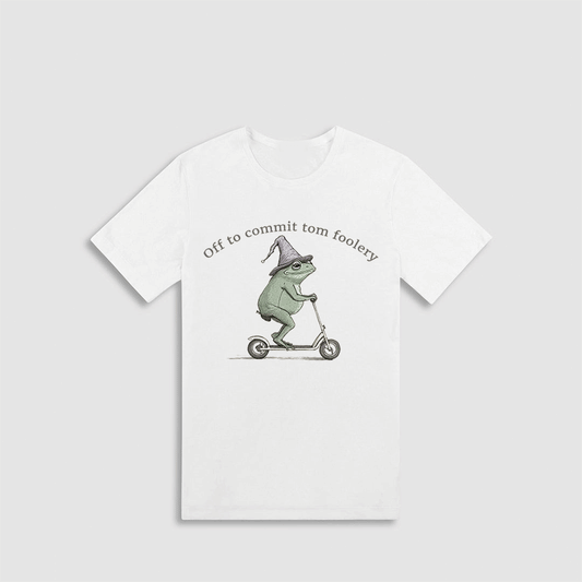 A white t-shirt with a graphic design depicting a frog riding a scooter and wearing a hat.