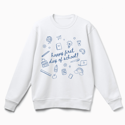 A white sweatshirt with a graphic design featuring various school-related items and the text "happy first day of school!"