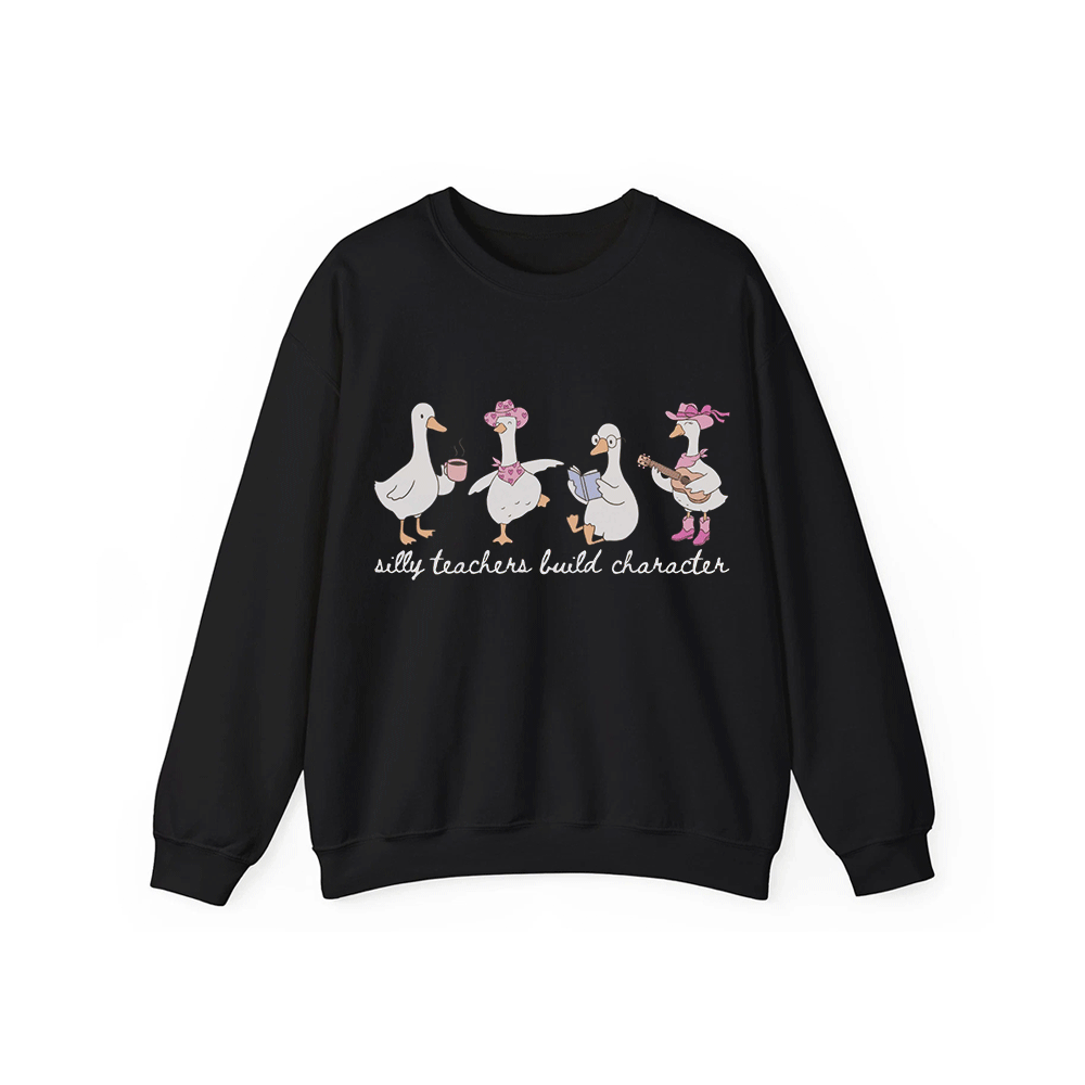 A black sweatshirt with a graphic design featuring four cartoon ducks, each with a unique hat and accessory, and the text "silly teachers build character" below them.