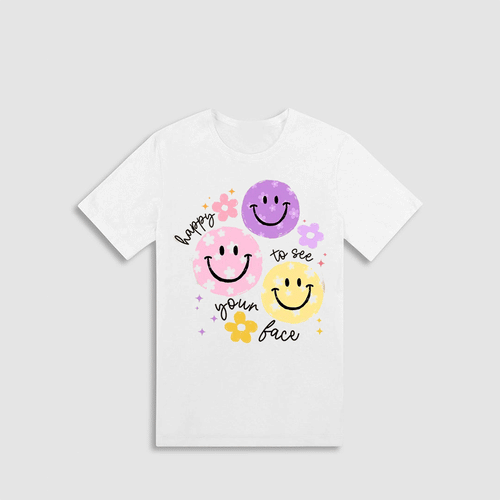 A white t-shirt with a graphic design featuring three smiling faces in different colors - pink, purple, and yellow - along with the text "hope to see your face" written around the edges.
