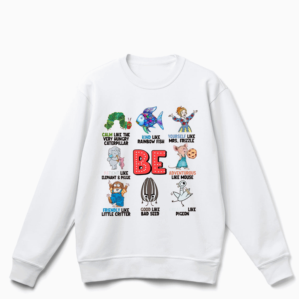 The image is a white sweatshirt with a graphic design featuring various cartoon characters and text.