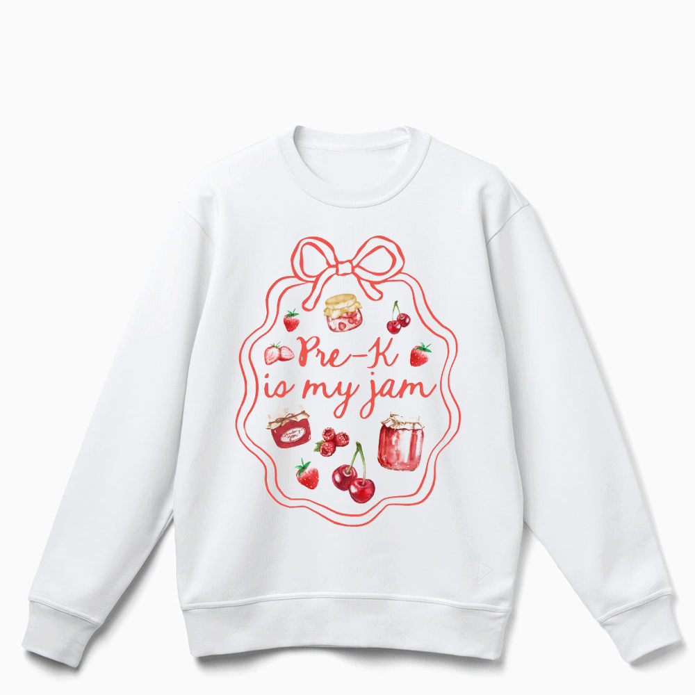 A white sweatshirt with a red and white design featuring a bow, cherries, and a jar of jam, along with the text "Pre-K is my jam".