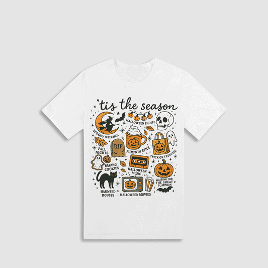 A white t-shirt with a graphic design featuring various Halloween-themed illustrations and text.