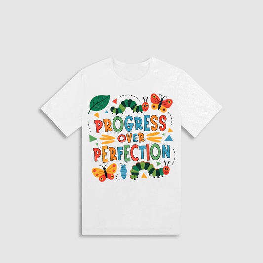 A white t-shirt with a colorful graphic design featuring the text "PROGRESS OVER PERFECTION" surrounded by various insects and butterflies.