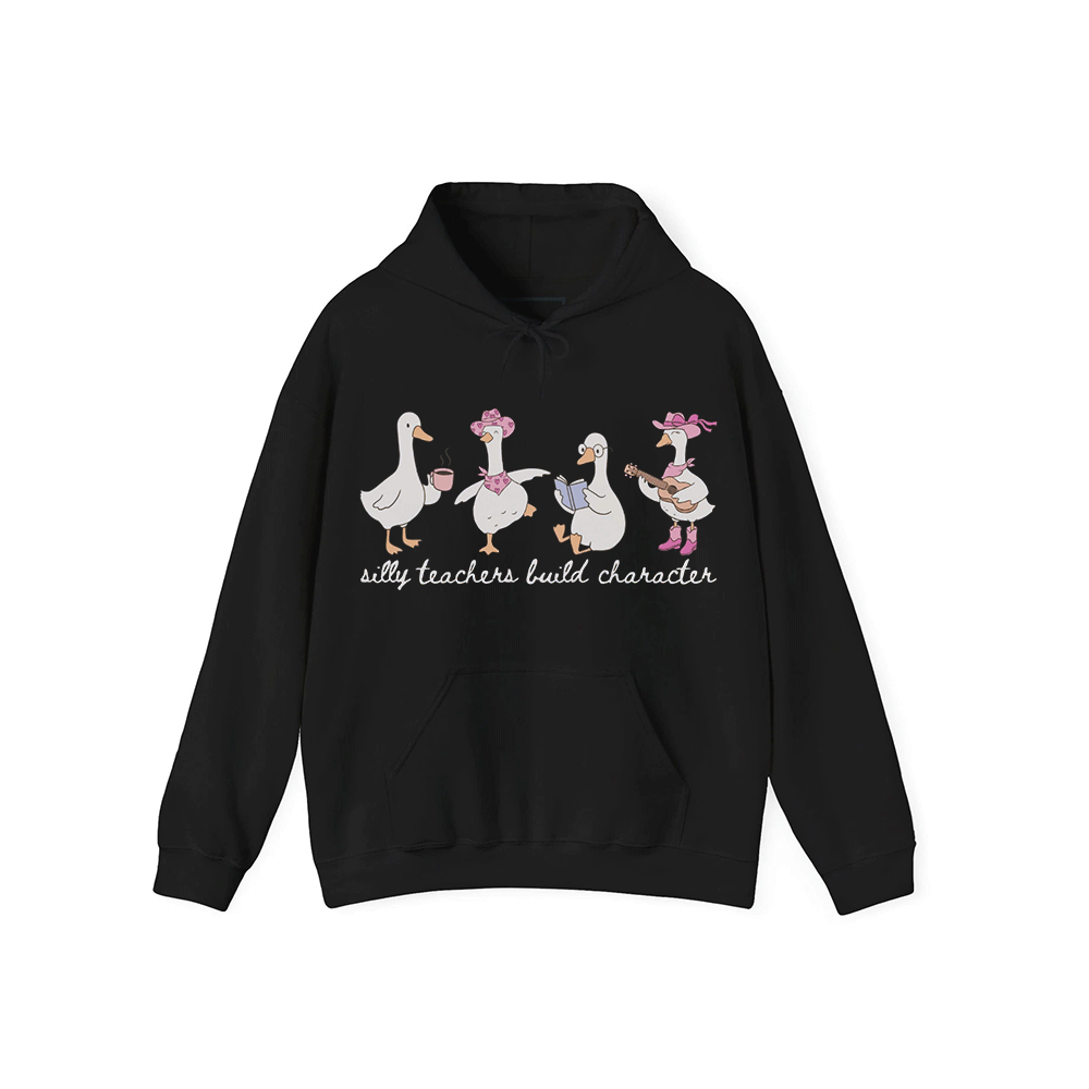 A black hoodie with a graphic design featuring four cartoon ducks, each with a unique activity or pose, and the text "silly teachers build character" below the image.