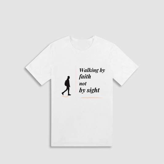 A white t-shirt with a black silhouette of a person walking and the text "Walking by faith not by sight" printed on it.